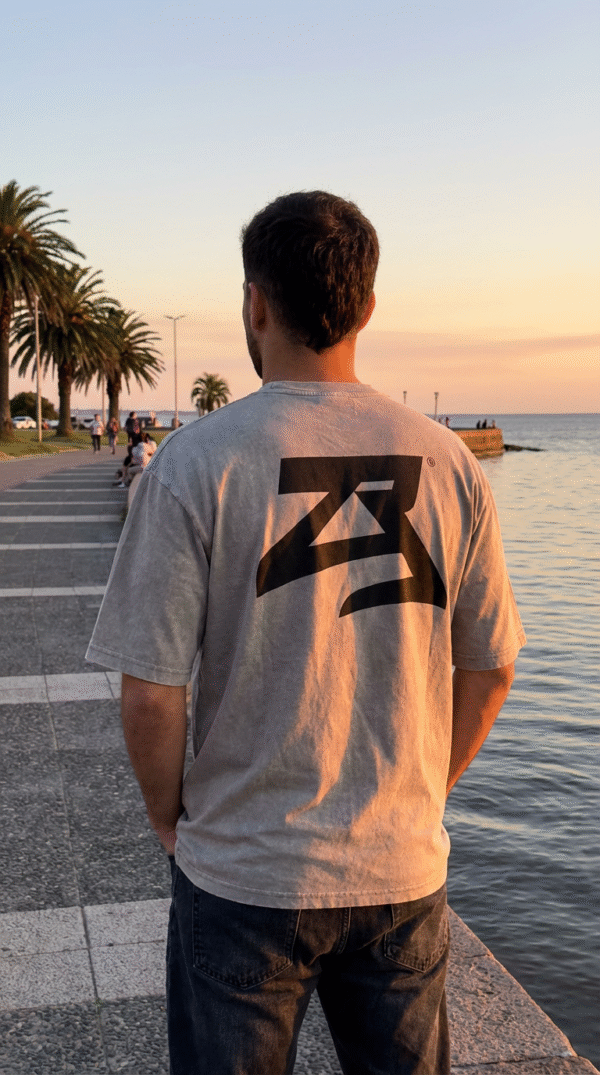 firefly gemini flash realistic photo of the same model from behind, wearing the same light grey stonewash 134598