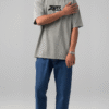 firefly gemini flash ultra realistic studio photo of a young male model wearing an oversized light grey st 134598
